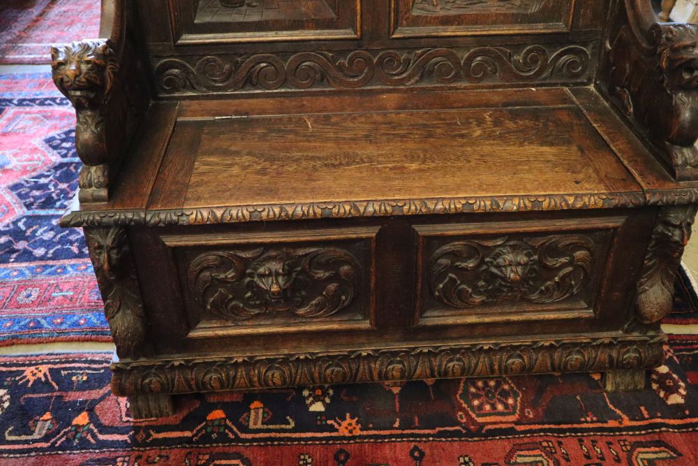 A late 19th century French carved box seat settle, width 100cm, depth 45cm, height 116cm
